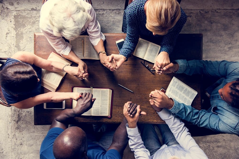 Group of people studying the Bible together.