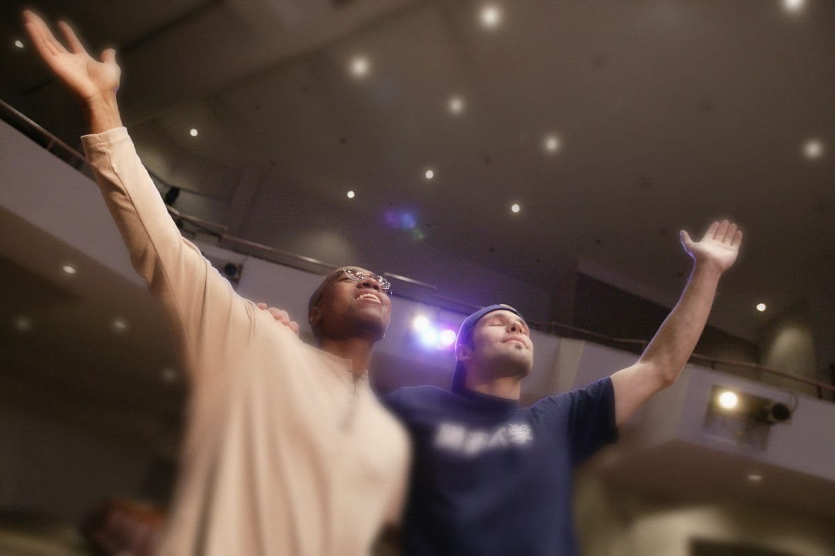 Two brothers in the Lord worshipping with joy.