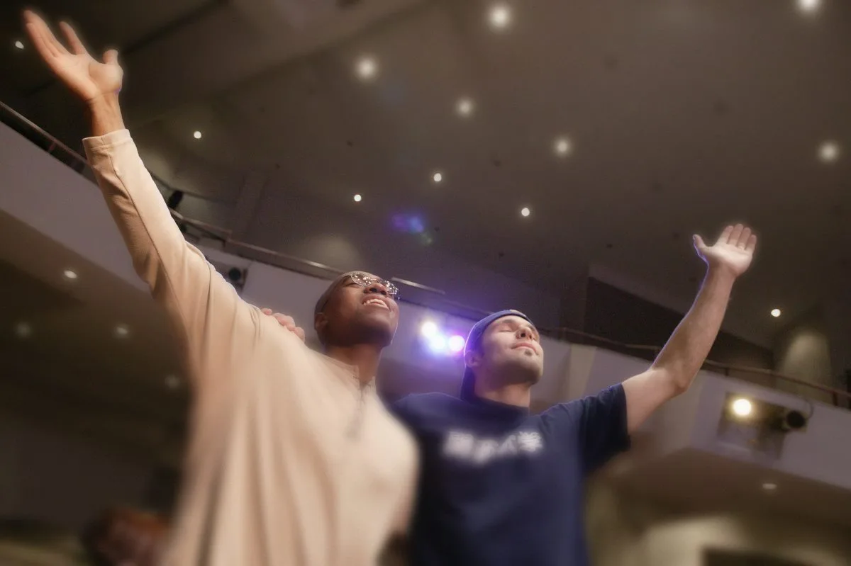 Two brothers in the Lord worshipping with joy.