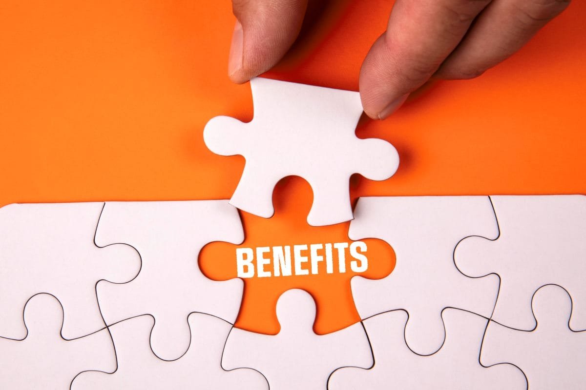 Puzzle with piece pulled out to reveal the word "benefits".