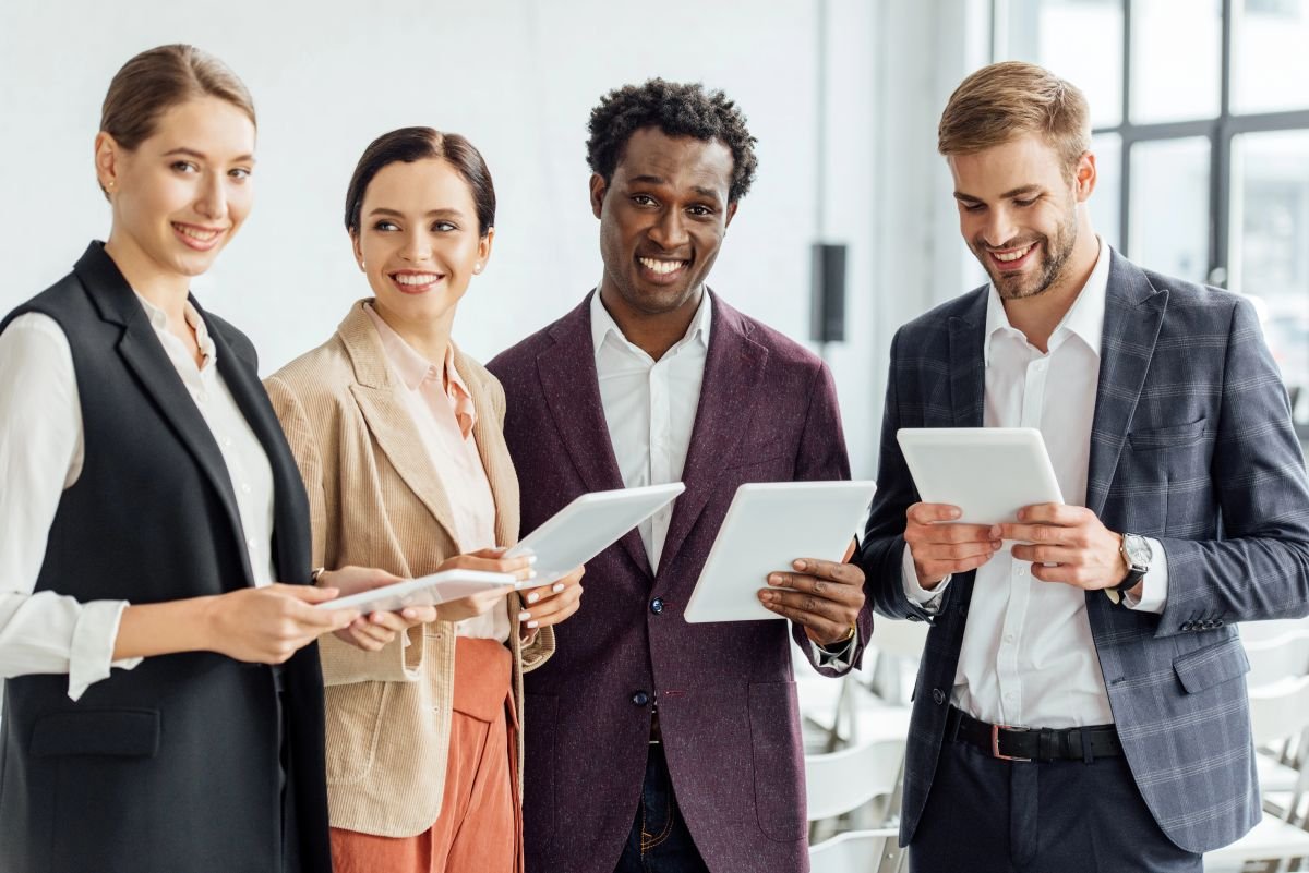 Group of colleagues comparing notes.