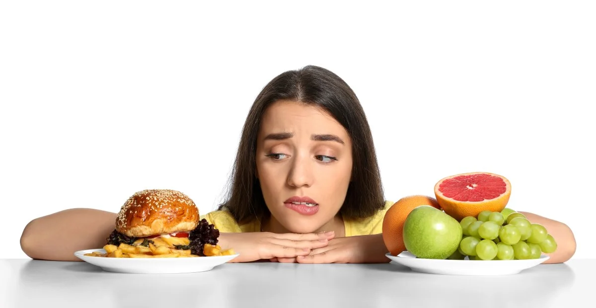 Woman weighing food options.